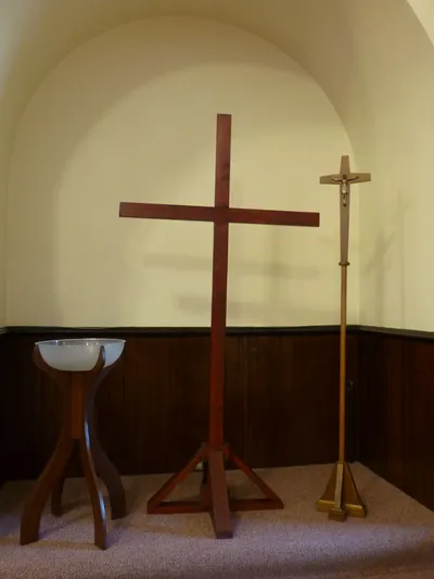 Cross, crucifix, baptismal font.
