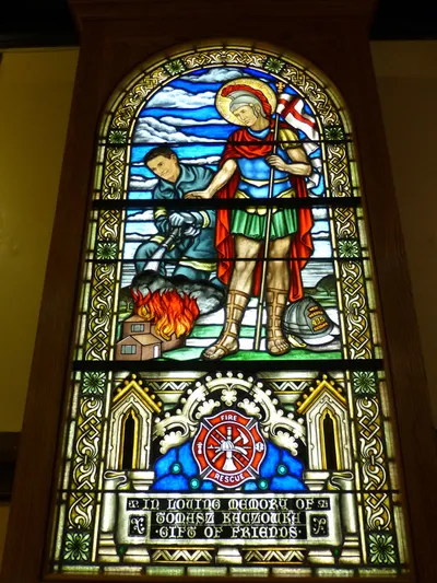 Stained glass in honor of the firefighter killed during the Christmas day shooting in W. Webster.