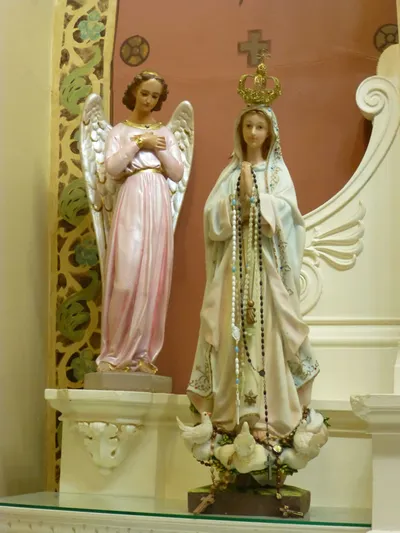 Angel and Our Lady of Fatima statue.