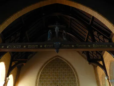 Wood beam and crucifix.