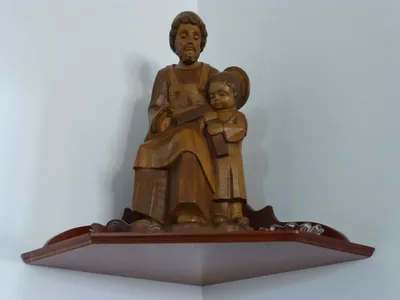 Wood carving of St. Joseph with Christ child.