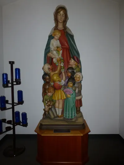 Statue of Our Lady with children of various ethnicities.