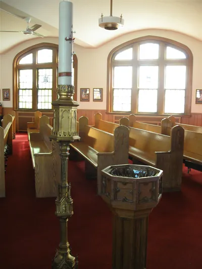 Baptismal font and paschal candle.