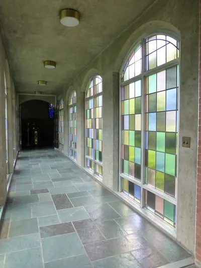 Stained glass and hallway leading to baptistry.