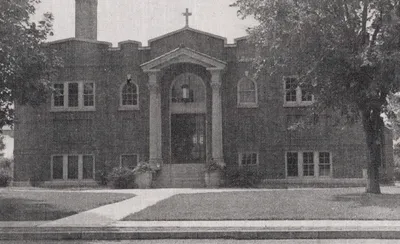 Exterior of original church/school, 1939. What was originally meant to be a temporary church in the school basement was used until the present church was completed in 1965. Source: Catholic Courier Golden Jubilee Edition: 1889-1939