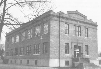 Former church/school. Cross not atop the school, so this was likely taken more recently.