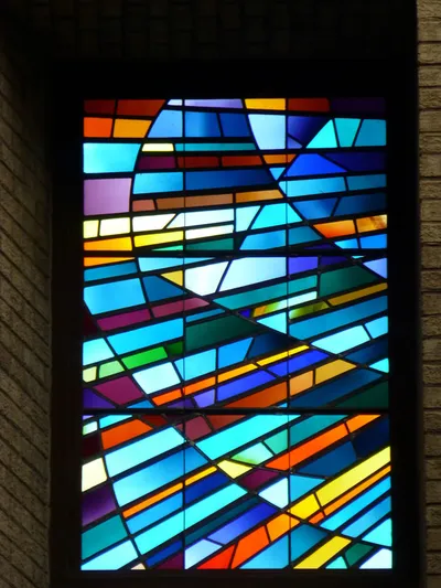Stained glass above sanctuary.
