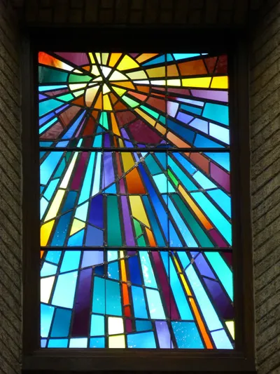 Stained glass above sanctuary.