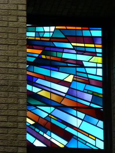 Stained glass above sanctuary.